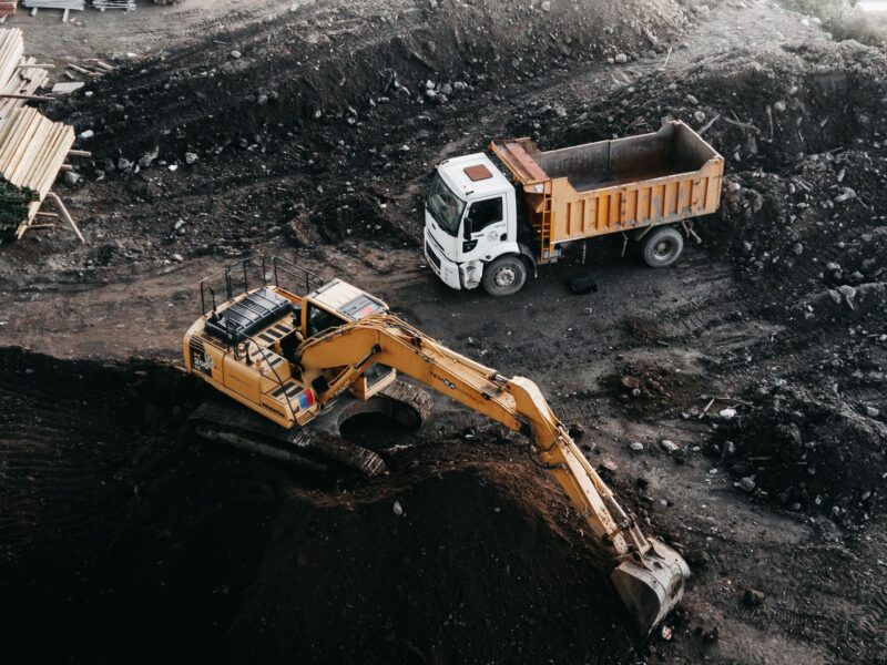 Dump truck and excavator at an industrial construction site in Istanbul, Turkey.